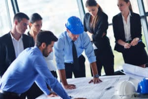 business people and engineers on meeting